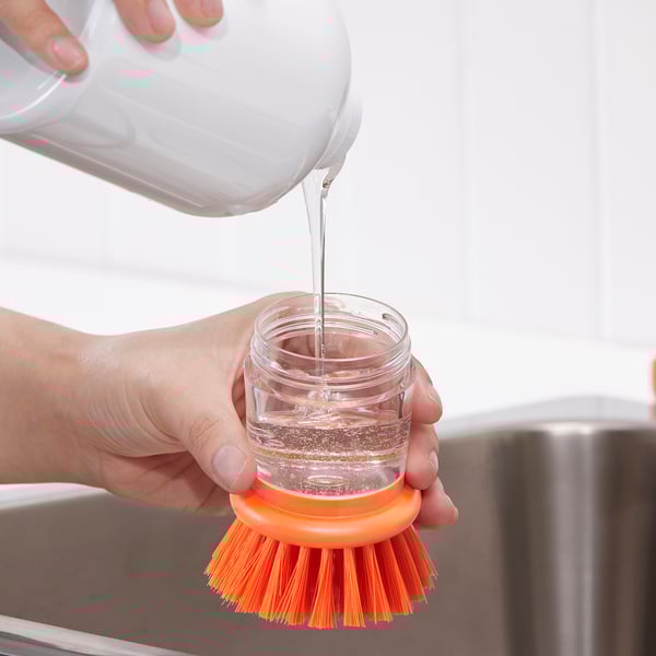 Dish-washing brush with dispenser